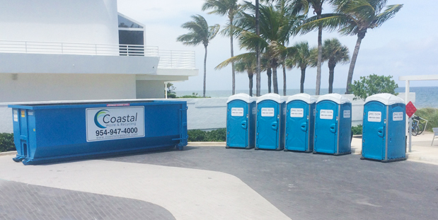 Portable Restroom by Precision Portables shown by the beach next to Coastal Waste roll off dumpster